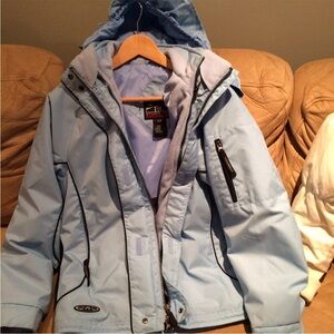 Blue Ski Jacket with High Collar and Waterproof Fabric